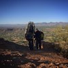 Two SAR personnel look for a safe route down for a recovery